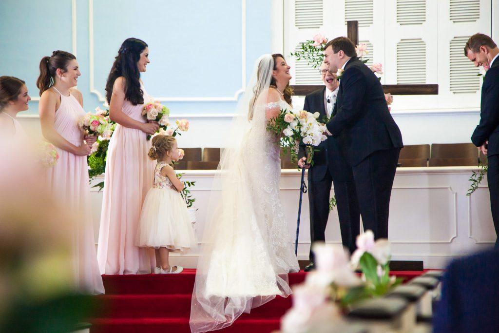 Lake Tahoe Wedding Photography Portfolio Church wedding ceremony with the bride and groom laughing and smiling during wedding photography
